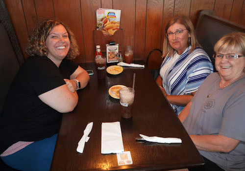 Friends Dine Around the Table at Carey Hilliard's.